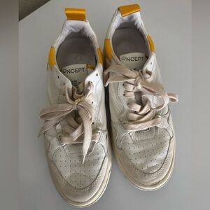 Oncept phoenix size 8 white with yellow trim sneakers 
White and Yellow Sneakers